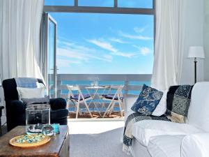 a living room with a view of the ocean at 2 Bed in Ventnor 75920 in Ventnor