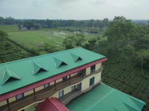 an overhead view of a building with a green roof at Maa Greenary View - A Holiday Resort in Alīpur Duār