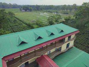 an overhead view of a building with a green roof at Maa Greenary View - A Holiday Resort in Alīpur Duār