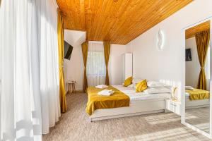 Postel nebo postele na pokoji v ubytování Casa Sinca