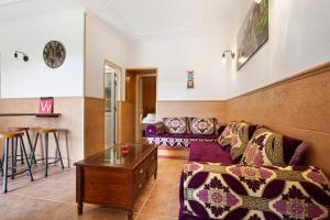 a living room with a couch and a table at Casa Doña Margarita in Tuineje