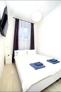 Posteľ alebo postele v izbe v ubytovaní Atlas Hotel