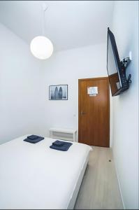 Televízia a/alebo spoločenská miestnosť v ubytovaní Atlas Hotel + 37 fotografií