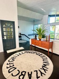 a living room with a door and a rug at MyHOME At Shangrila Height in Kota Kinabalu