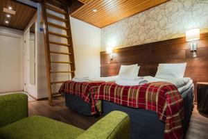Postel nebo postele na pokoji v ubytování Lapland Hotels Sirkantähti