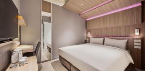 Katil atau katil-katil dalam bilik di Orange Hotel -Hanzhong, Taipei