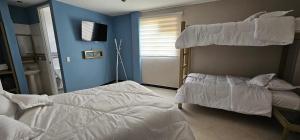 Letto o letti in una camera di Hotel Ocean Fusagasuga