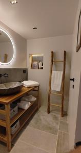a bathroom with a sink and a mirror at MALU' Exclusive Retreat in Pescocostanzo
