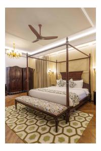 a bedroom with a four poster bed and a ceiling at ama Stays & Trails Rang Mahal, Jaipur in Jaipur +43 photos