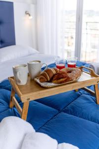 a tray of croissants and bread on a table at Nel Cuore di Parthenope in Naples
