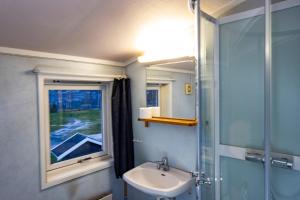 a bathroom with a sink and a window at Lillehammer Camping in Lillehammer +63 photos