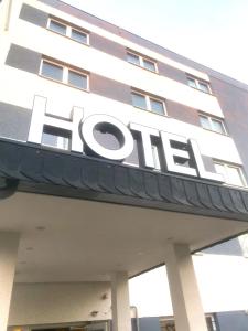 a building with the sign for the hotel at Hotel 22 in Dessau