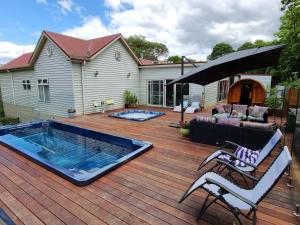 a deck with a swimming pool on a house at Rosebank Guesthouse in Healesville