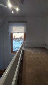 an empty room with a window in a room at Apartman Funn5 - ApartHotel Vucko - private host in Jahorina