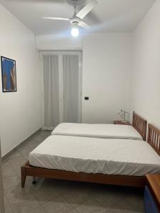 Ένα ή περισσότερα κρεβάτια σε δωμάτιο στο Residenza Adelaide 2