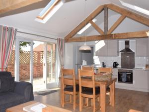 a kitchen and living room with a table and chairs at 2 Bed in Winterton on Sea 29236 in Winterton-on-Sea