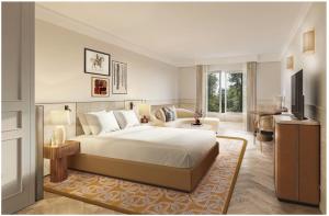 a bedroom with a large bed and a living room at InterContinental Hotels Chantilly Chateau Mont Royal, an IHG Hotel in La Chapelle-en-Serval
