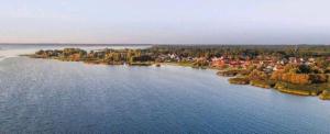 an island in the middle of a large lake at Nordblue 8 in Altwarp