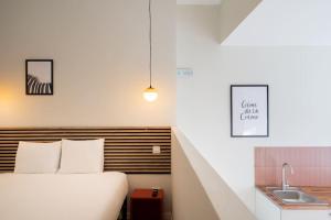 a bedroom with a bed and a sink at Nice studio in Madrid-Fp02 in Madrid