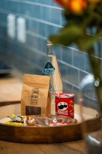 a table with a bottle of krispy krispy treats and a bag at 505 La Roche, Paarl in Paarl