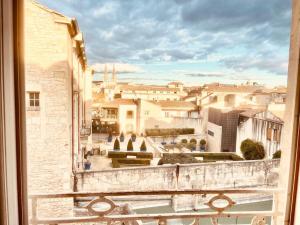 a view of a city from a window at Évasion Urbaine**** in Nîmes +3 photos
