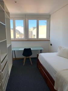 En eller flere senge i et værelse på Apartamento vistas Coruña 3 habitaciones