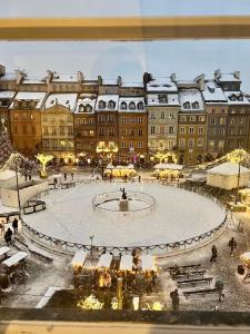 a view of a large building with a large plaza at Warsaw Premium Apartments MARKET VIEW Old Town in Warsaw