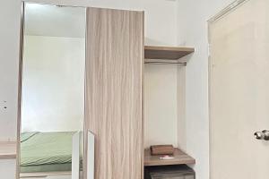Postel nebo postele na pokoji v ubytování Barata Residence Aeropolis