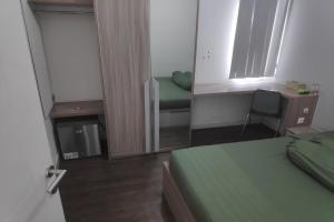 Postel nebo postele na pokoji v ubytování Barata Residence Aeropolis