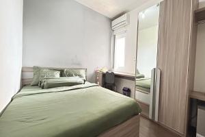 Postel nebo postele na pokoji v ubytování Barata Residence Aeropolis