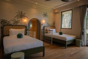 A bed or beds in a room at Poco Poco villas by Aayan