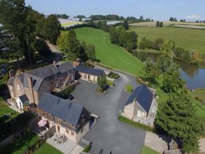 an aerial view of a house with a large driveway at 2 Bed in Leominster 50518 in Pencombe