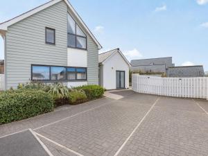 a house with a white fence and a driveway at 3 Bed in Westward Ho 50072 in Northam