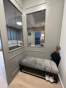 a room with a bench in front of a door at Apartmán Ferula in Stará Lesná