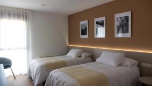 Cama o camas de una habitación en La Hospedería - El Provencio