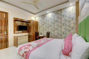 Letto o letti in una camera di Smart Plaza Hotel