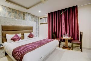 Letto o letti in una camera di Smart Plaza Hotel