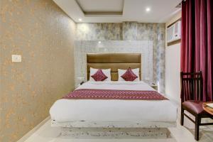 Letto o letti in una camera di Smart Plaza Hotel