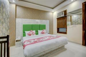 Letto o letti in una camera di Smart Plaza Hotel