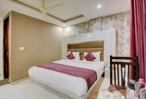 Letto o letti in una camera di Smart Plaza Hotel