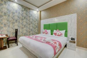 Letto o letti in una camera di Smart Plaza Hotel