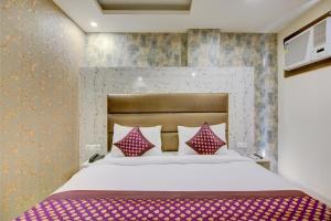Letto o letti in una camera di Smart Plaza Hotel