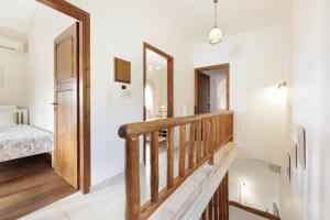 A bed or beds in a room at Villa Magnolia Corfu
