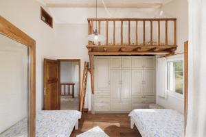 A bed or beds in a room at Villa Magnolia Corfu