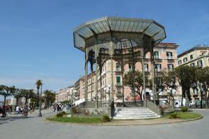 a building with a large metal structure in front of it at Appartamento La Vecchia Ferrovia in Castellammare di Stabia