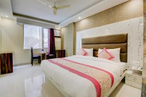 Letto o letti in una camera di Smart Plaza Hotel