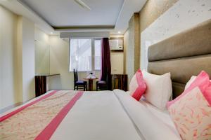 Letto o letti in una camera di Smart Plaza Hotel