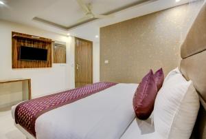 Letto o letti in una camera di Smart Plaza Hotel