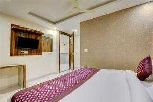 Letto o letti in una camera di Smart Plaza Hotel