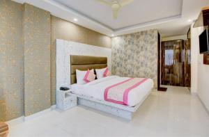 Letto o letti in una camera di Smart Plaza Hotel
